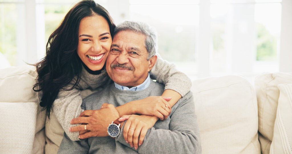 caregiver-portrait-and-smile-of-old-man-with-daughter