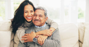 caregiver-portrait-and-smile-of-old-man-with-daughter