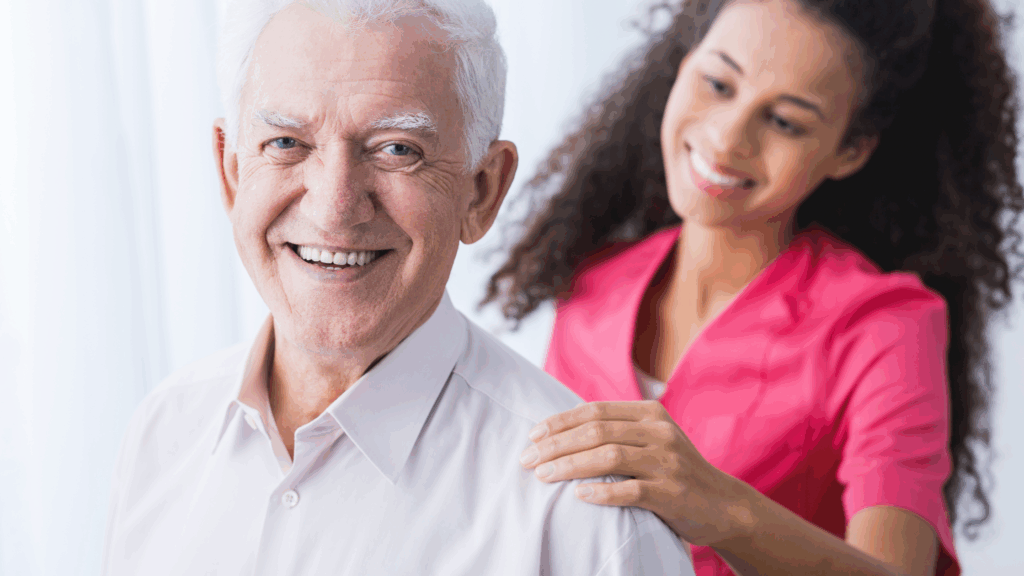 Family caregiver helping an elderly parent with a daily caregiving routine at home